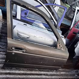 Chapa de puerta Nissan v-16 twimcan año:2004